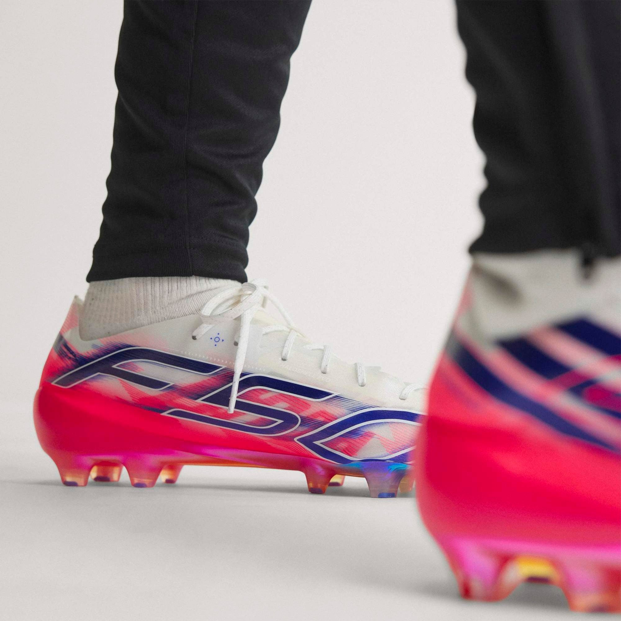 adidas F50 Hyperfast EVO Firm-Ground Low-Top Soccer Cleats - Cloud White / Solar Purple / Solar Turbo