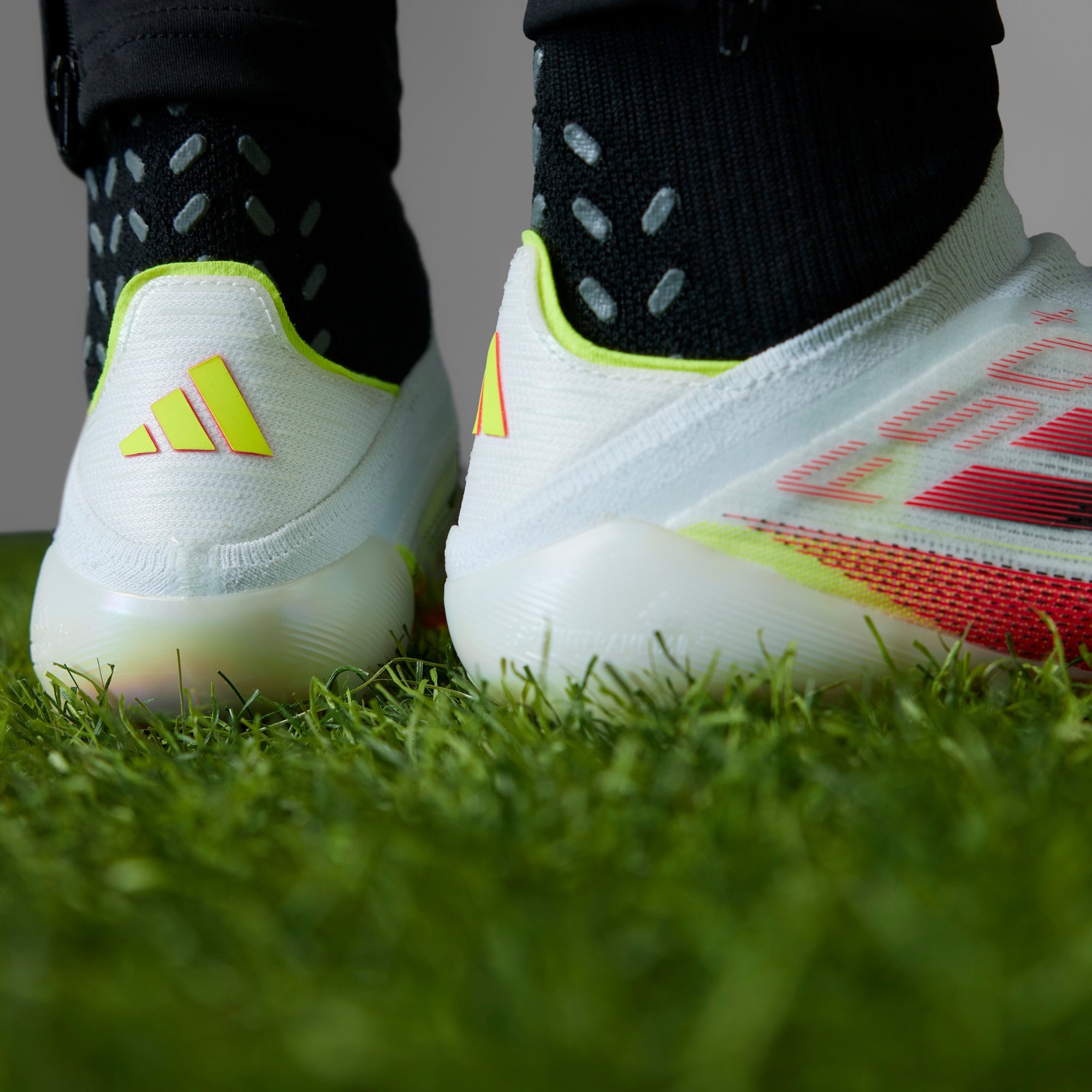 adidas F50+ FG Low-Top Soccer Cleats - Cloud White / Core Black / Solar Yellow