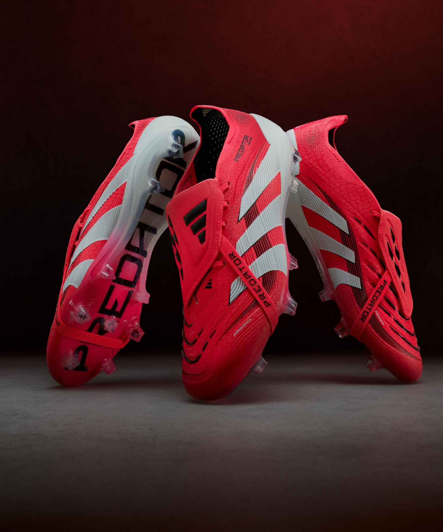 adidas Predator 25 soccer cleats in red with fold-over tongue, STRIKESKIN rubber strike zone and HYBRIDTOUCH 2.0 upper