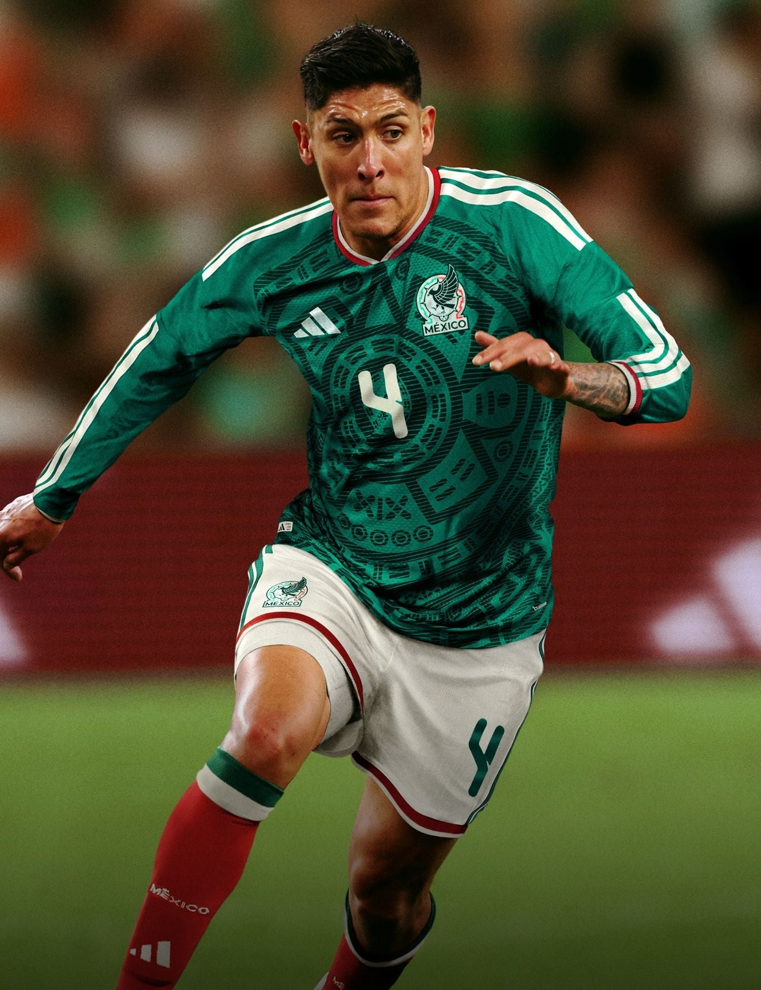 Soccer player in a Mexico uniform on a field