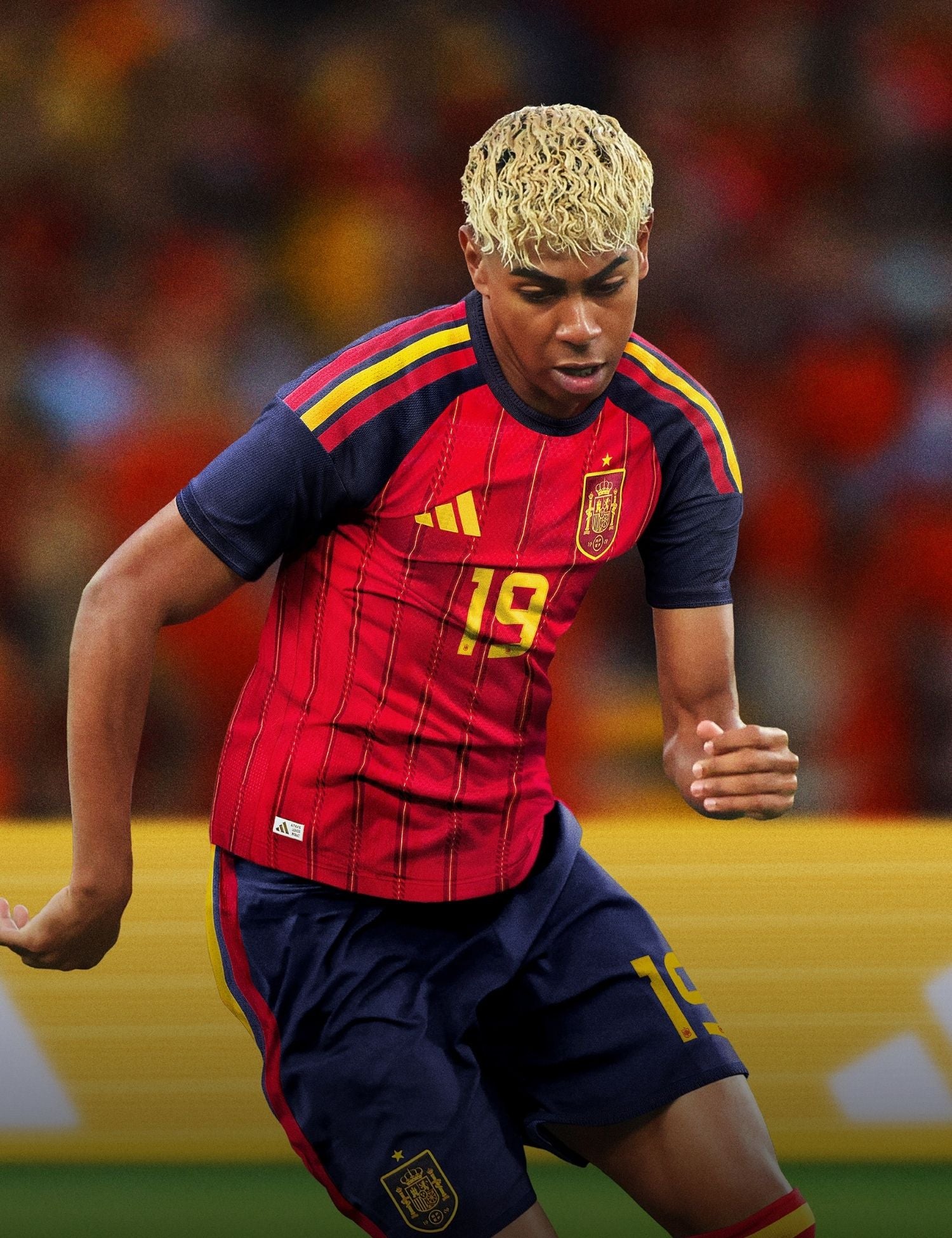 Soccer player in Spain national team jersey on a blurred stadium background