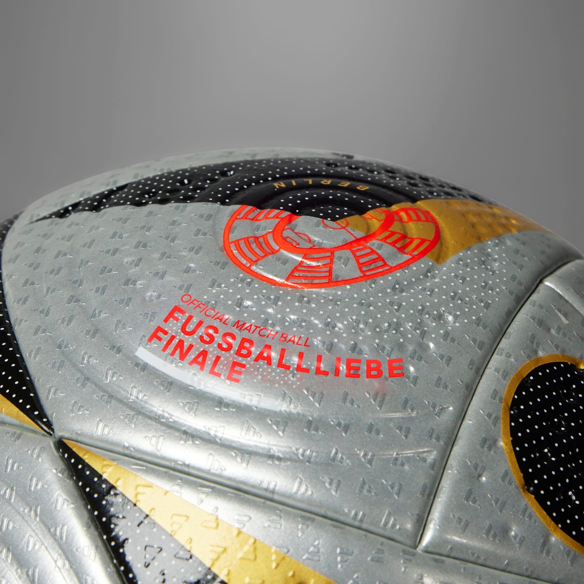 adidas Fussballliebe Finale Pro Soccer Ball - Silver Metallic / Gold Metallic / Black / Solar Red