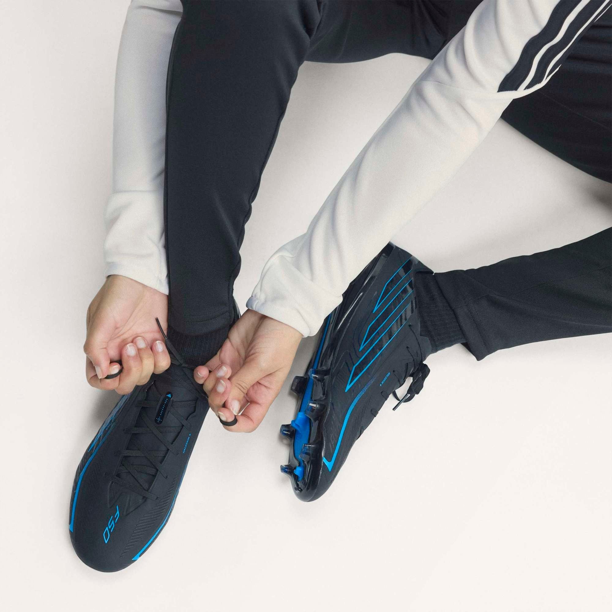 adidas F50 Hyperfast Pro Firm-Ground Low-Top Soccer Cleats - Core Black / Core Black / Lucid Ray Blue