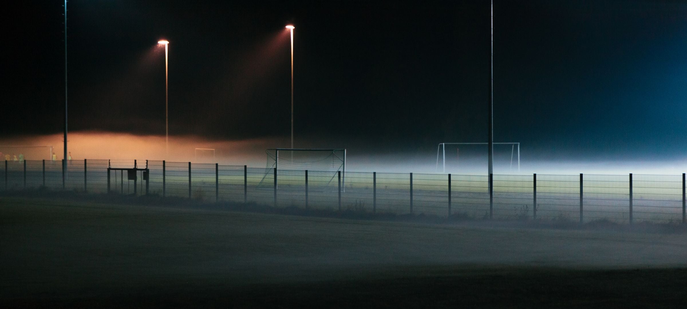 Dark and misty soccer field